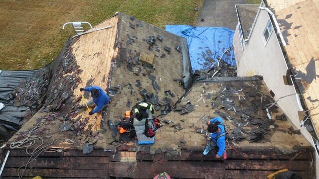 Two Layers of Shingles Are Removed
