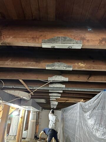 Brackets Are Applied to Floor Joists