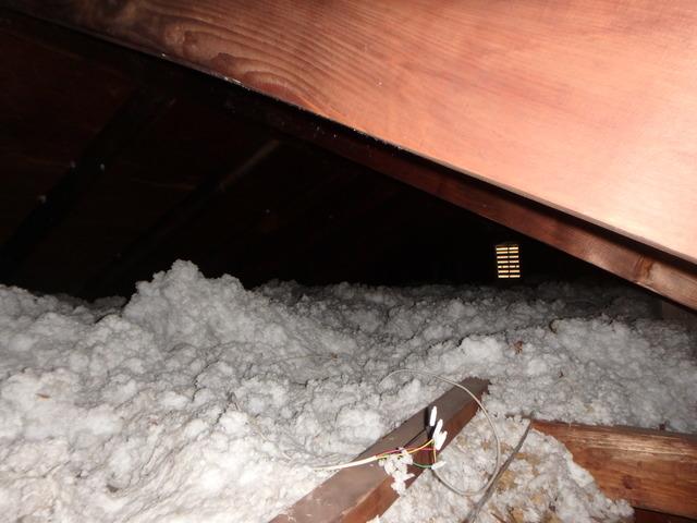 <p>This photo captures another angle of the old and dirty attic insulation.&nbsp;</p>