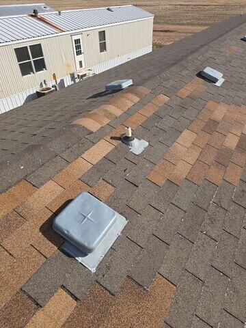 Installment of 3 tab shingles.