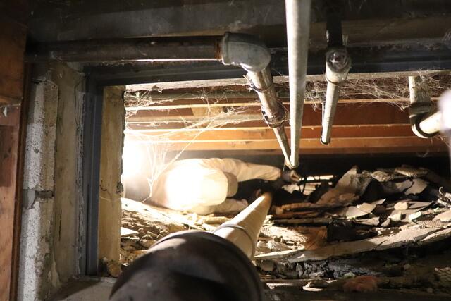 Crew Member Caden Beginning Work on Crawlspace