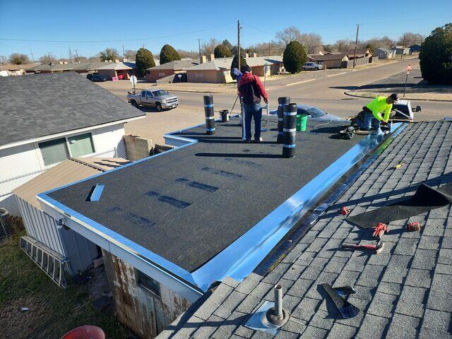 Preparing the roof for torch down.