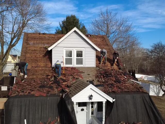 Old Shingles Come Off & Sheathing Is Exposed