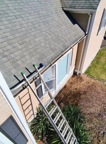 Gutter cleaning in progress