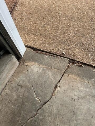 Before: Cracked Concrete Slab at Garage Threshold