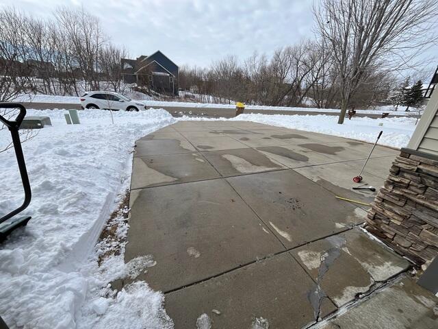 Before: Driveway settling and uneven surface