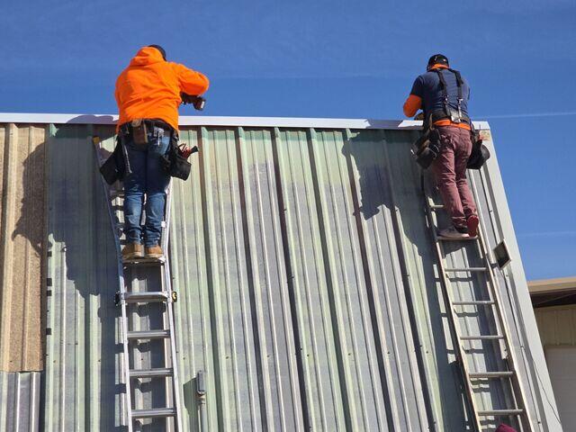 Crew placing R-Panels
