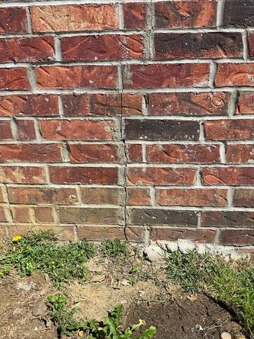 Brick Wall Cracks at the Foundation Line