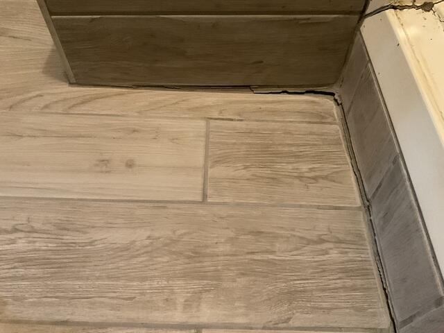 Sagging Tile Floor Indicates Foundation Shift