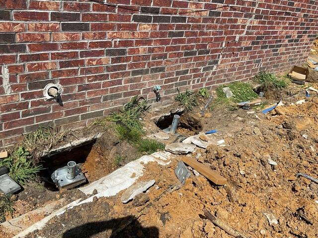 Helical Pier Installation for Settling Brick Foundation