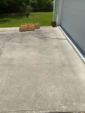 Cracked and Uneven Concrete Driveway