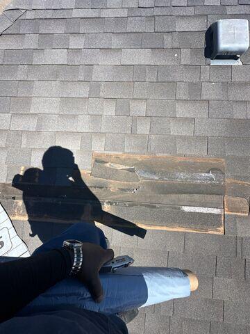 Shingles flapping on the roof.