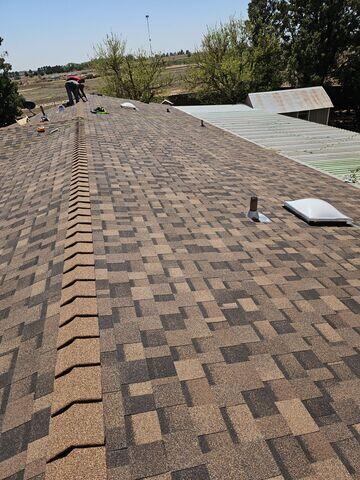 Adding the last touches to the roof.