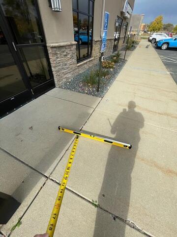 Entryway Poses Trip Hazard from Sinking Concrete