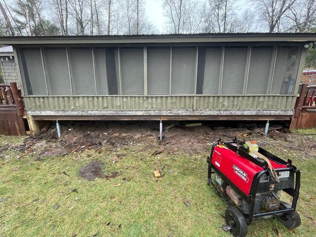 Exterior Foundation Anchored with Helical Piers