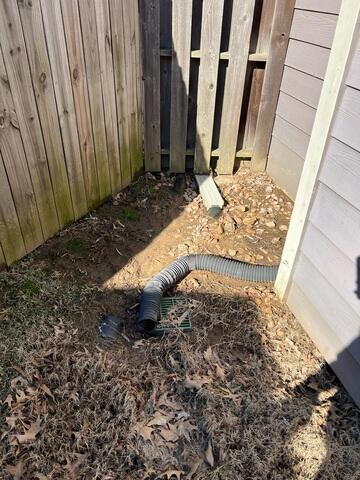 Water Pooling at Fence Line and Downspout