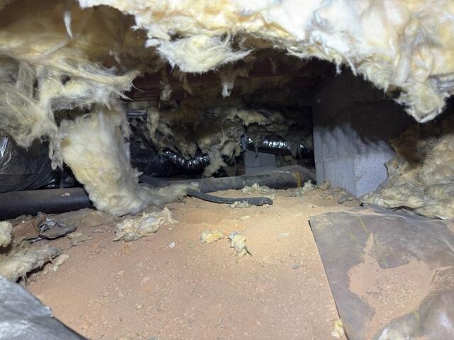 Damaged Insulation and Exposed Dirt