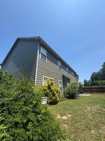 Side of home after gutter installation