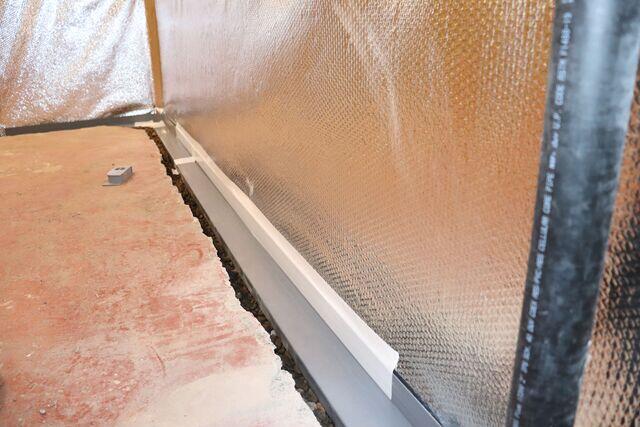 Installing WaterGuard Drainage Pipe.