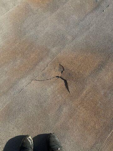 A crack and uplifted section.