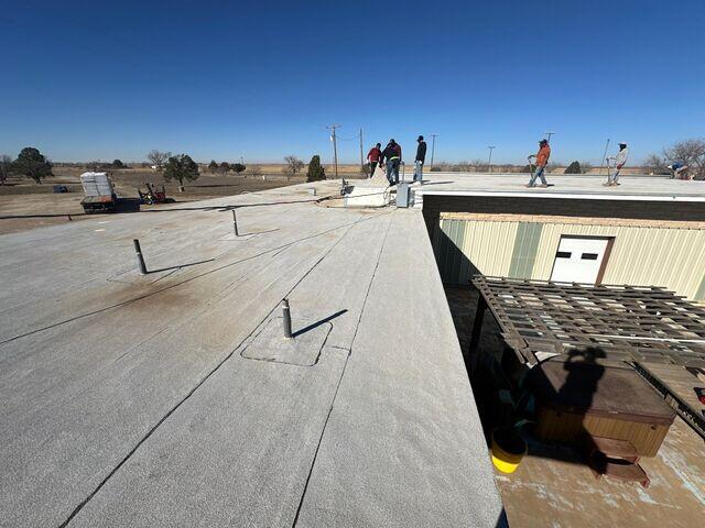 Crew Members working to get temporary roof repair.