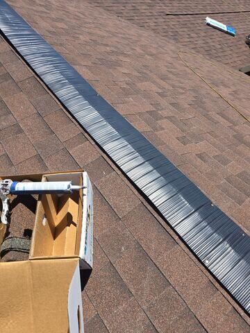 Ridge vent being installed.