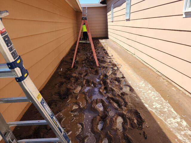 Gutter installation even in the mud.