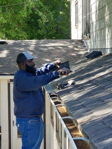 Installation of gutter guard.