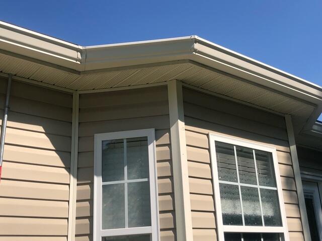 Side of home after gutter installation