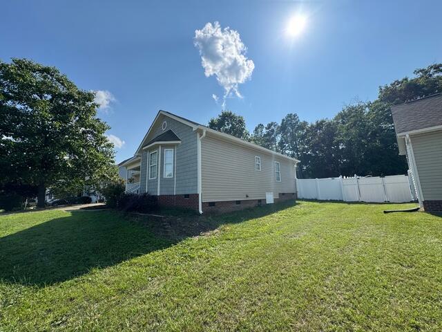Side of home after gutter installation