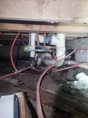 Wet Crawl Space with Plumbing Obstacles