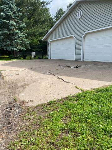 Sunken and Cracked Driveway Before Repair