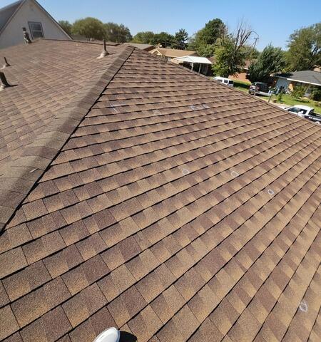 Wider view of hail damage to the roof.