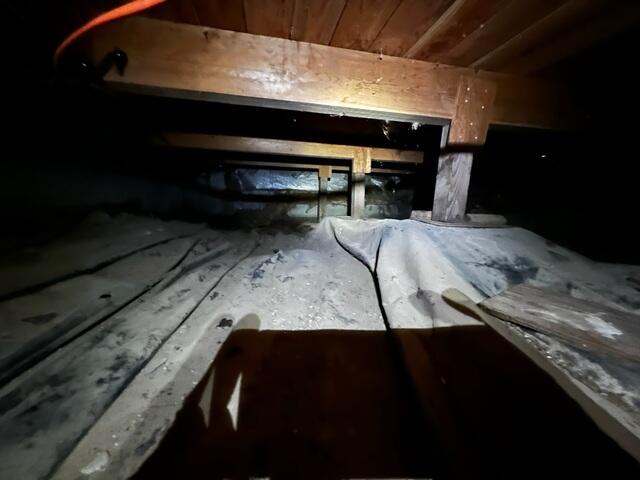 Debris and Rips in Vapor Barrier.