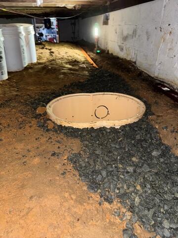 Sump Pump Pit Installation Begins to Combat Crawl Space Water Intrusion - Winston-Salem, NC