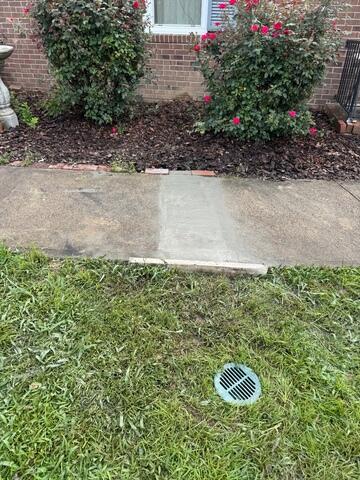 Clean Finish: Discreet Drainage Outlet and Concrete Restoration - Winston-Salem, NC