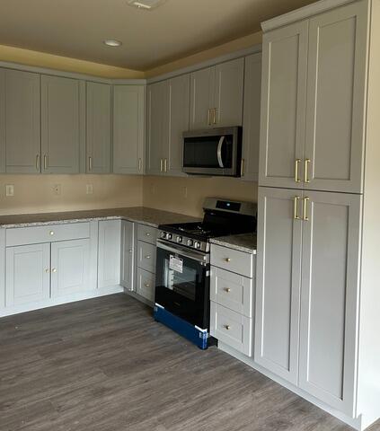 Restored Kitchen Flooring, Cabinets, and Appliances