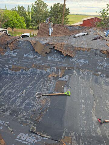 Crew removing shingles