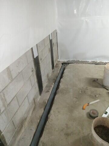 Wall membrane and drainage system added.
