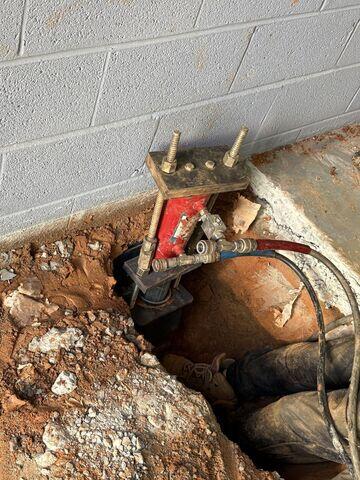 Installing Push Piers for Foundation Stabilization