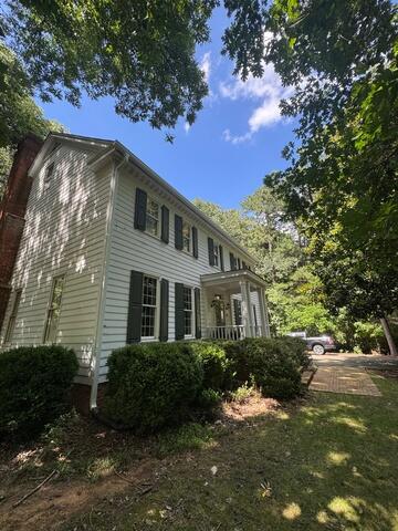 Side of home after gutter installation
