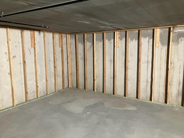 Water-Stained Concrete Walls in Unfinished Basement