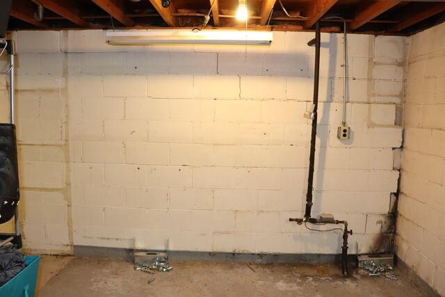 Cracked and Bowing Basement Wall Before Repair
