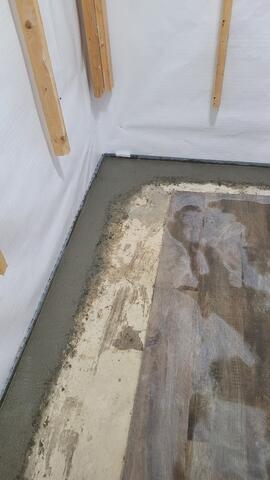Concrete finishing over piping system