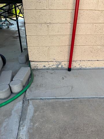 Slab corner - vertical cracks at tie‑down straps - stem wall foundation