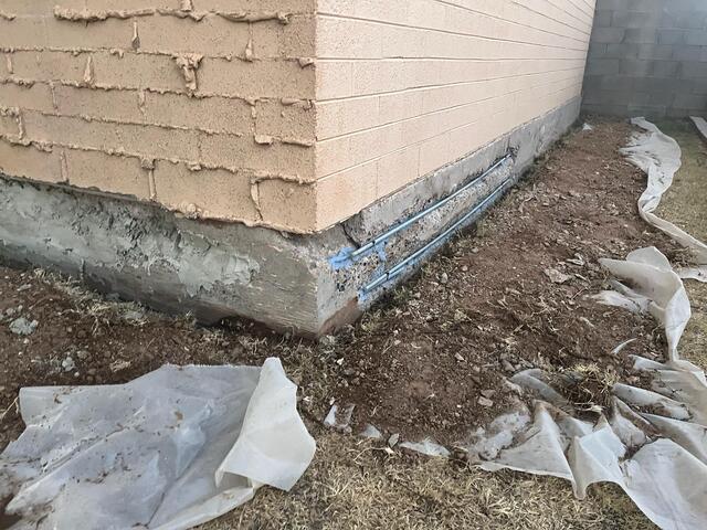 Plastic sheeting protects landscape - stem wall foundation
