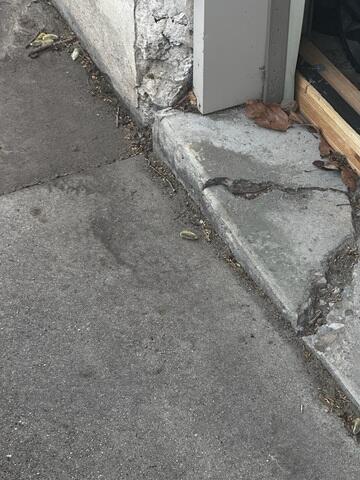 Cracked Driveway at Garage Corner in Salt Lake City