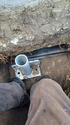 Securing Helical Piers to Foundation Footer