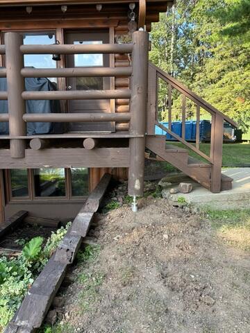 Helical Pier Installation Under Porch Beam