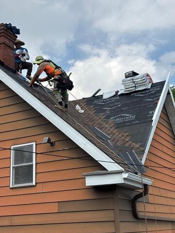 New shingles being installed
